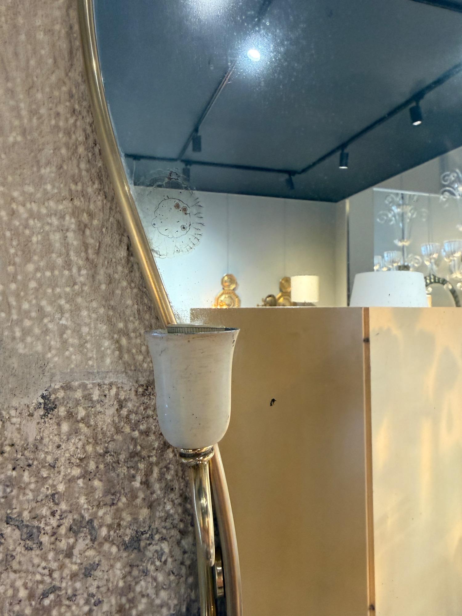 Italian brass mirror with sconces circa 1950