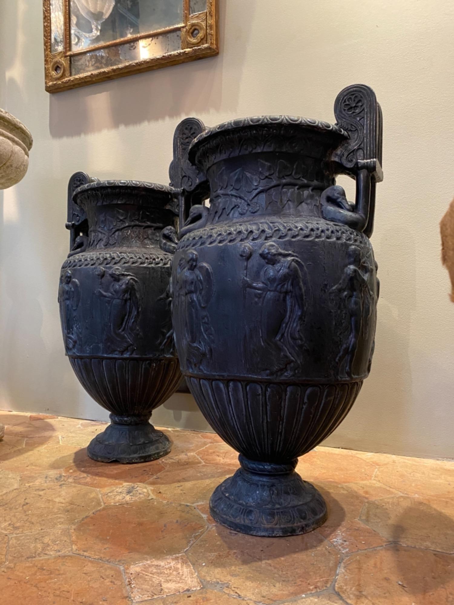 Pair of French cast iron urns 19th c 