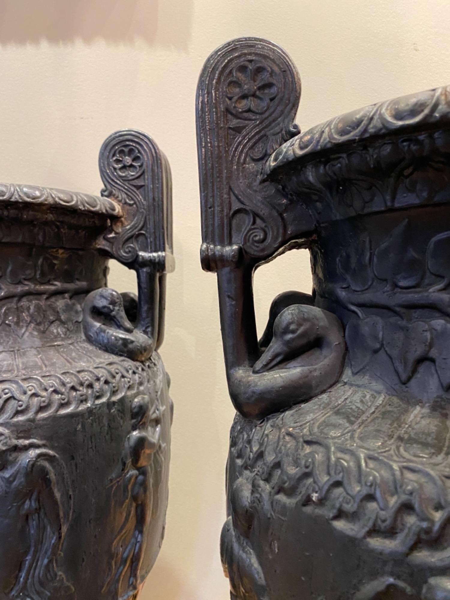 Pair of French cast iron urns 19th c 